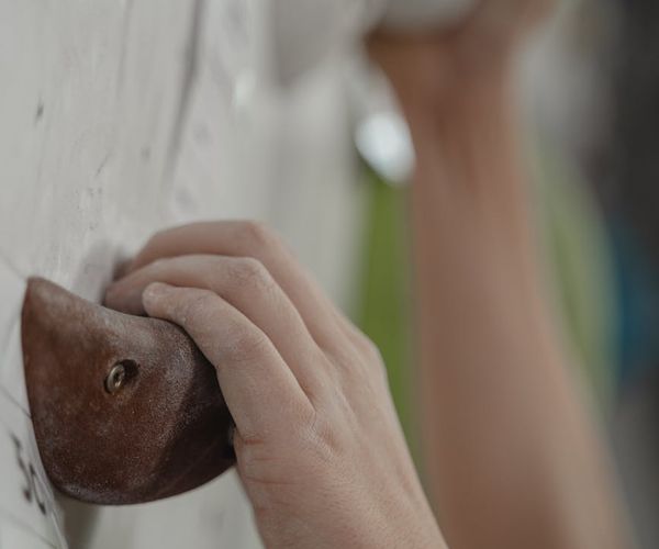 Close-up of a person's hands in a precise, focused grip during an exercise.